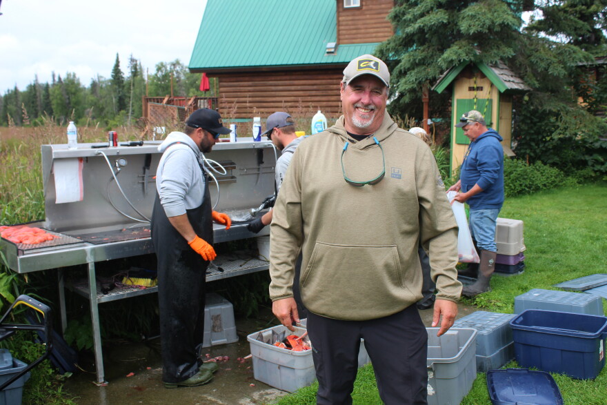 Joe Hanes stands in front of the fish cleaning station at his business, Fish Magnet, on Thursday, Aug. 13, 2026 in Soldotna, Alaska.