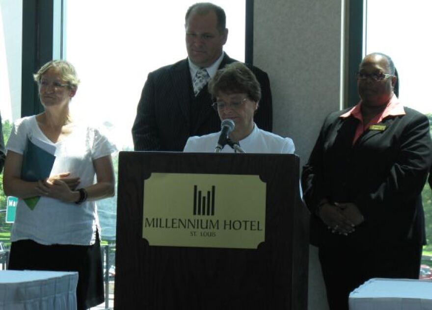 Sister Kathy McCluskey speaks at the signing of the ECPAT code at the Millennium Hotel St. Louis Tuesday. Hotel General Manager Dominic Smart stands behind.