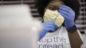 A health care worker draws a vaccine dose at a Novant Health COVID-19 vaccine clinic at Spectrum Center on Feb. 13.