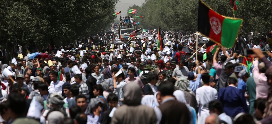 Thousands of demonstrators march towards the center of Kabul, Afghanistan on Saturday.