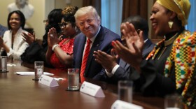 President Trump smiles at Angela Stanton-King at an African American history event at the White House. A few days later, Stanton-King was a speaker at a Black Voices for Trump event in Milwaukee.
