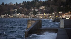 Water spills over a set of stairs that typically lead to the beach during a King Tide at Alki Beach Park on Tuesday, Dec. 5, 2017, in West Seattle. (Megan Farmer/KUOW)