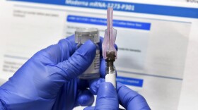 In this July 27, 2020 file photo, a nurse prepares a shot as a study of a possible COVID-19 vaccine, developed by the National Institutes of Health and Moderna Inc., gets underway in Binghamton, N.Y. (Hans Pennink/AP)