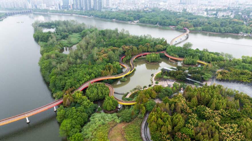 Jinhua Yanweizhou Park in China, Water resilient terrain and plantings are designed to adapt to the monsoon floods; A resilient bridge and paths system are designed to adapt to the dynamic water currents and people flows. (Courtesy of Turenscape)