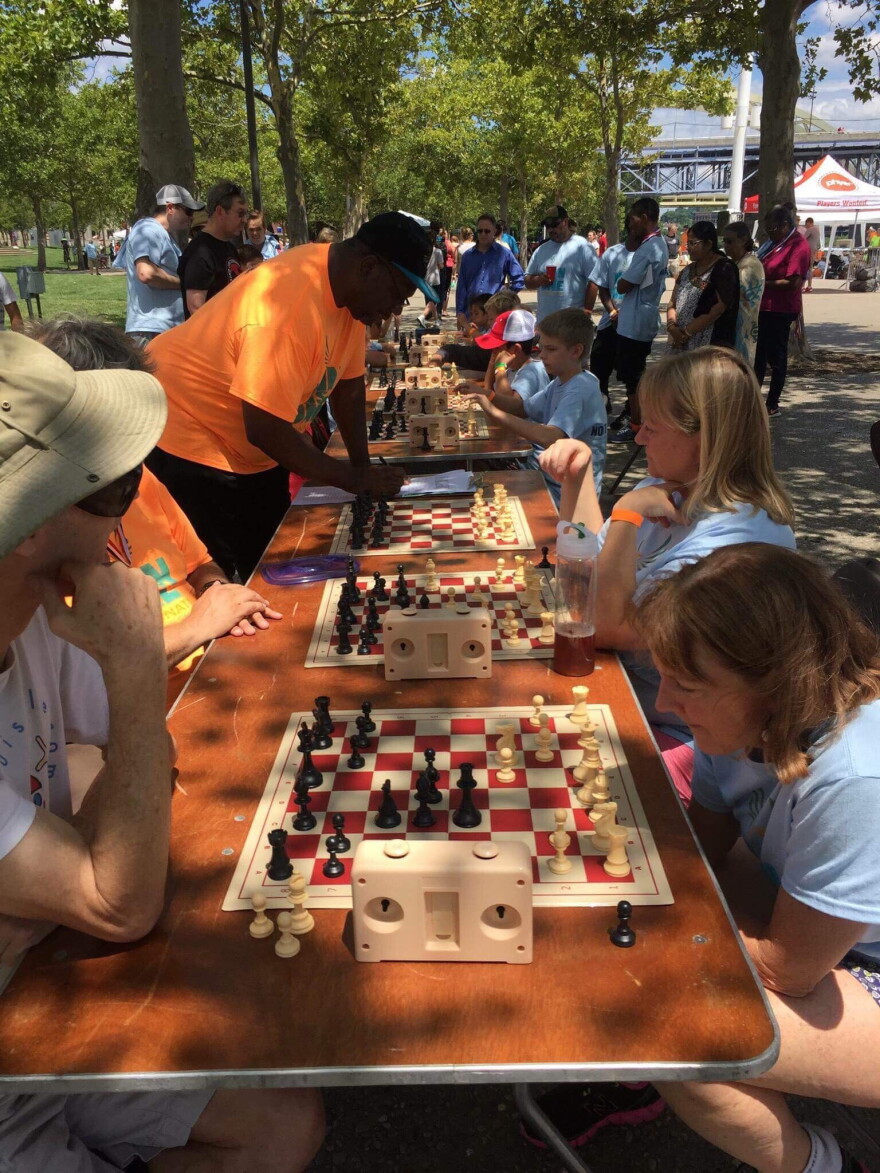 Participants in the first-ever Neighborhood Games compete in a chess tournament. The Games were first held in 2016 and take place every other year.