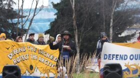 More than 100 people rallied in support of climate and environmental action in Anchorage’s Town Square Park, blocks away from the Dena’ina Center, where the Alaska Federation of Natives Convention is being held. (Wesley Early/Alaska Public Media)