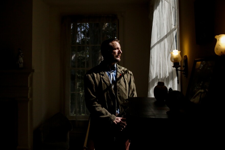 William Griffith, curator of Rowan Oak, poses for a portrait in an upstairs bedroom.