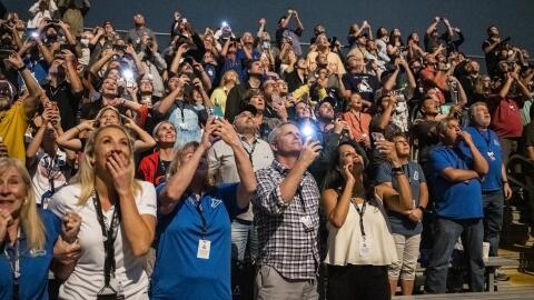 Guests at the Banana Creek viewing site watch the Nov. 16, 2022, launch of NASA’s Space Launch System rocket carrying the Orion spacecraft on the Artemis I flight test at the Kennedy Space Center.