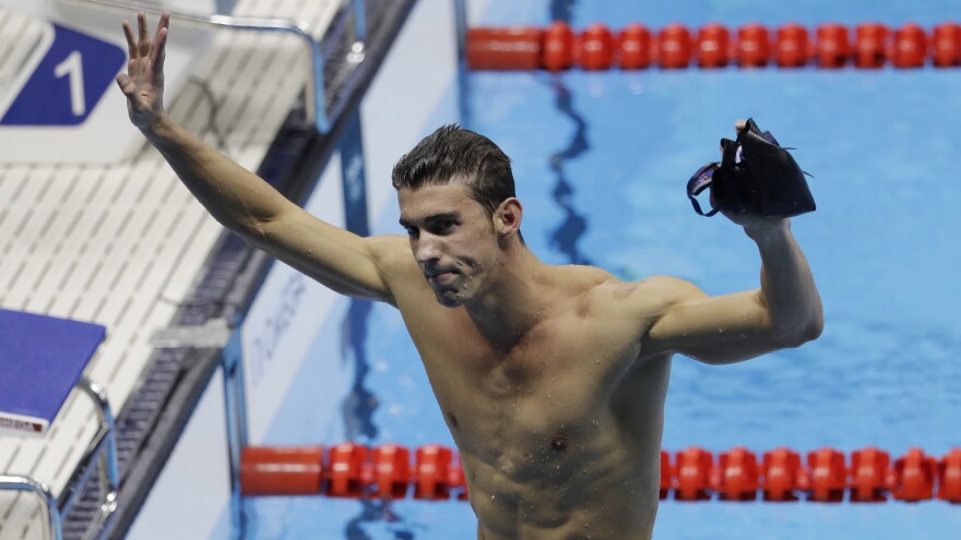 Michael Phelps celebrates winning the gold medal Thursday in the men's 200-meter individual medley. It's was his fourth gold in Rio and the 22nd in his Olympic career.