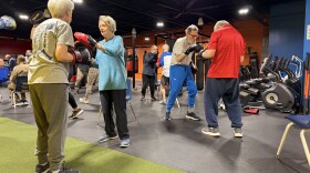 People take a boxing class at the Parkinson's Exercise and Wellness Center. The classes are designed to improve symptoms and slow the progression of Parkinson's disease.