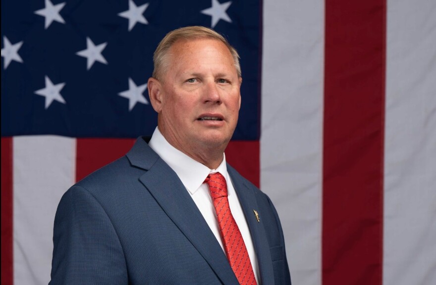 Republican 17th Congressional District candidate Scott Crowl poses in front of a U.S. flag.  