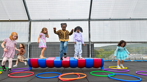 Kindergarten students in the St. Clair Area School District play on the rooftop playground during recess.