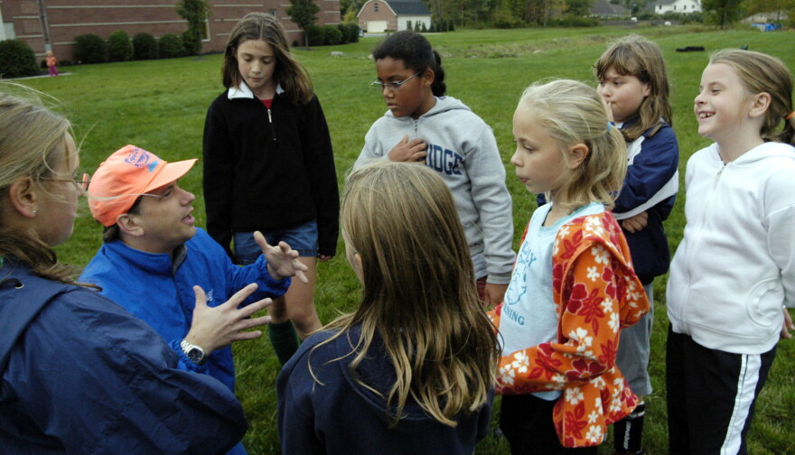 Coach Kenyon Mau talks to Team Germany during Westlake Youth League girls soccer practice in Westlake, Ohio, on Oct. 11, 2005. 
