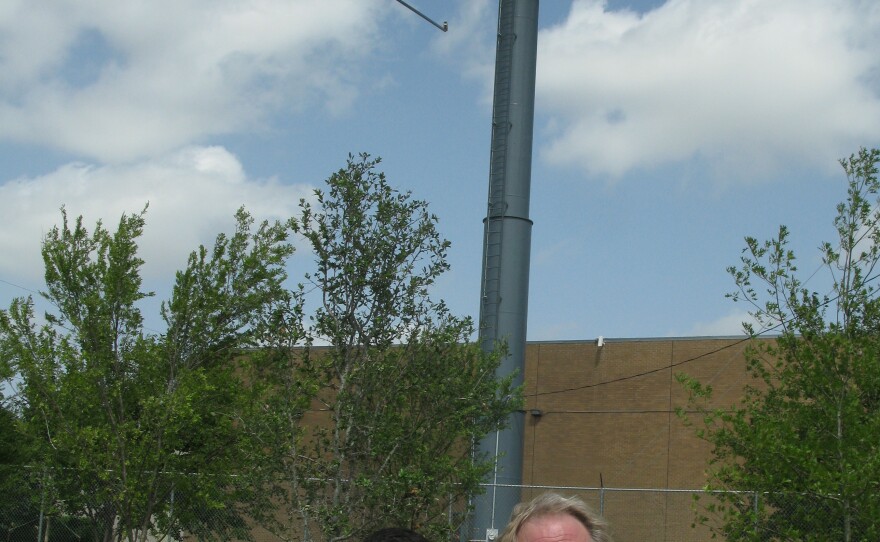 Don Glendenning, president of Scenic Dallas, stands with volunteer Marc Shidid below one of Dallas' new digital billboards.