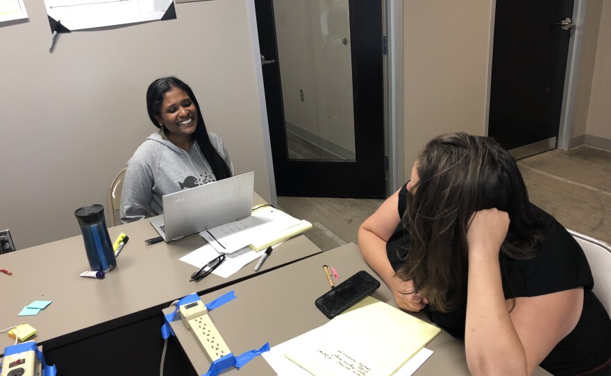 Levy and volunteer Shalini Thomas dealing with the paperwork and logistics of family unifications.
