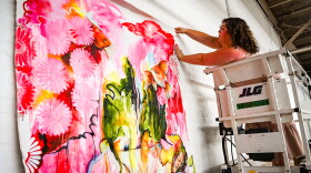 Artist Bree Stallings hangs a self portrait for the 'Not in Repose' exhibition at Goodyear Arts. She describes that portrait as vulnerable and symbolic of her Southern and Japanese heritage.