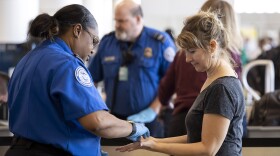 Employees with the Transportation Security Administration are seen working at the Phoenix Sky Harbor International Airport in Phoenix, Arizona on Feb. 7, 2023.