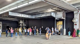 Kentuckians visiting the Bowling Green regional driver's license center waited in a line that snaked from the office to the the adjacent parking garage on Apr. 22, 2025.