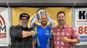 John Peel. owner of Busy Drones Cleaners LLC, center, with What's Up Yuma? Radio hosts Jonny Porter and Victor Calderón.