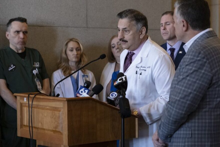 Dr. Saqib Naseer, a cardiologist for Eastern Connecticut Health Network, speaks at a rally at the state Capitol to preserve Manchester Memorial Hospital, Rockville General Hospital and Waterbury Hospital.