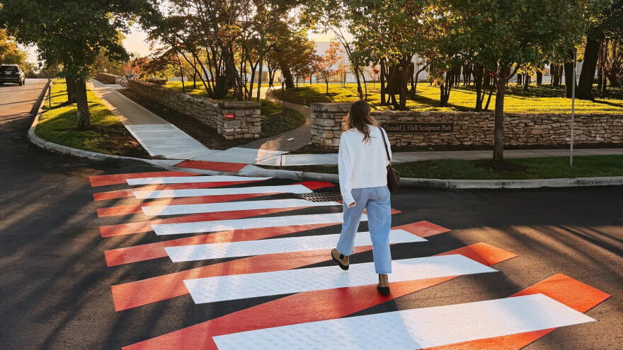 A woman crossing a street