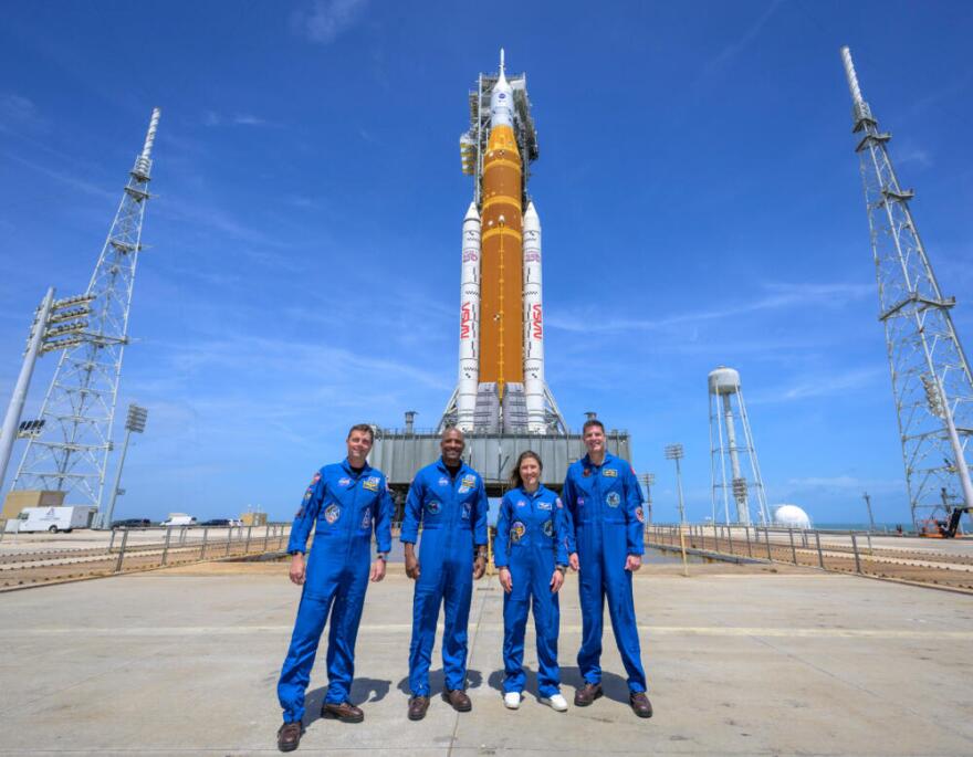 NASA astronauts Reid Wiseman, Artemis II commander, from left, Victor Glover, Artemis II pilot, Christina Koch, Artemis II mission specialist, and CSA (Canadian Space Agency) astronaut Jeremy Hansen, Artemis II mission specialist, right, in a group photograph as they visit NASA's Artemis II SLS (Space Launch System) rocket and Orion spacecraft, Monday, March 30, 2026, at Launch Complex 39B of NASA's Kennedy Space Center, in Cape Canaveral, Fla. (Bill Ingalls/NASA via AP)