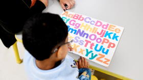Joanna Isitt, 28, reads with her son, Xavier Rogers, 4, before teaching her Head Start class at Hometown Child Care on Wednesday, Sept. 23, 2026, in Aurora, Ill. (Octavio Jones/AP)