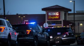 Police respond to an attack on a King Soopers grocery store in Boulder, Colo., where a gunman opened fire Monday. Ten people, including a police officer, were killed.