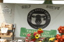 A sign for a roadside farm stand.