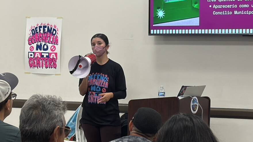 Viva La Causa organizer Ash Vega speaks with residents after the Coachella City Council meeting on Wednesday, Aug. 26, 2026. Vega said door-to-door outreach and public education helped residents build support for a data center ban.