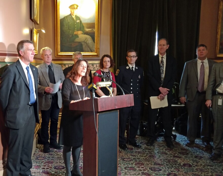 Governor Phil Scott (left) joins Drug Prevention Policy Director Jolinda LaClair (at podium) and others at Vermont's Opioid Awareness Day