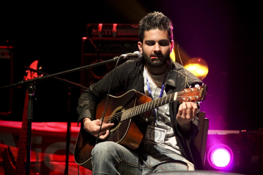 The 23-year-old, Colorado-born Omar (shown here performing an acoustic set with a member of District Unknown) says he was pleasantly surprised by the vibrant music scene he found when he landed in Kabul last year.
