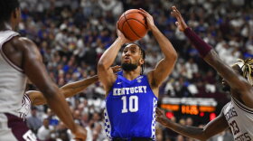 Kentucky guard Davion Mintz (10) shoots next to Texas A&M guard Tyrece Radford (23) during the first half of an NCAA college basketball game Wednesday, Jan. 19, 2022, in College Station, Texas. (AP Photo/Justin Rex)