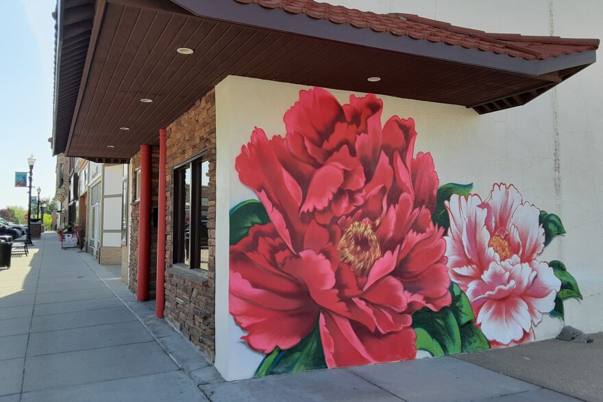 Peonies painted on the side of a building.