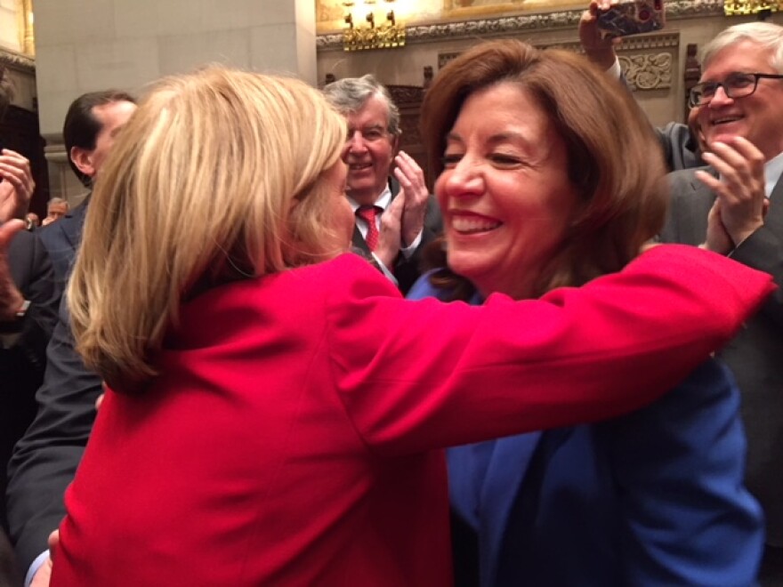Lt. Gov. Kathy Hochul gets a hug from newly elected state Sen. Shelly Mayer, after Hochul swore Mayer in in the Senate chamber Monday.