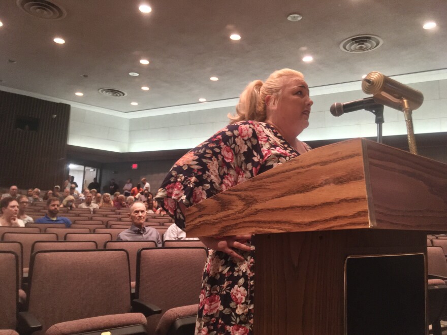 Robi Rodriguez speaks at an Alma city planning commission meeting Wednesday in opposition to a proposal to rezone the land occupied by a vacant nursing home so it could become a shelter for young refugees. The planning commission voted against recommending the rezoning.