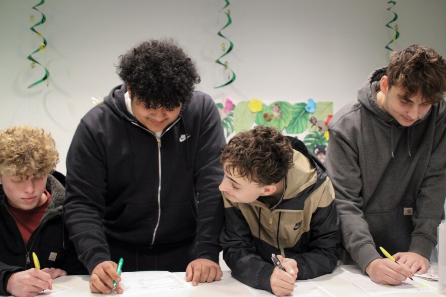 Students line up during lunch to sign up for an account with the Winnetonka High School's credit union.