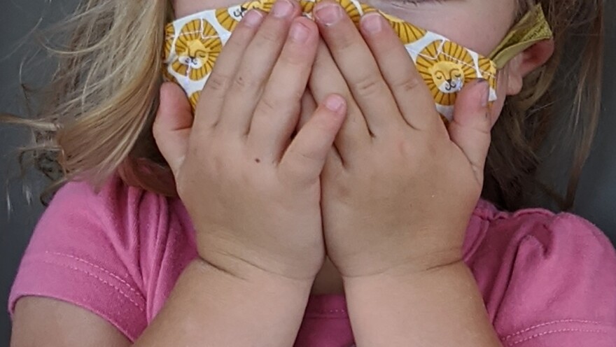 child wearing a mask