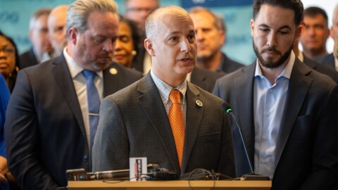 Lansing Mayor Andy Schor at a press conference where Michigan local officials declared their opposition to proposed state preemptive zoning laws.