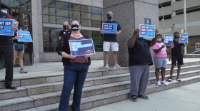 Around fifteen people rallied, starting at Senator Young's office at 12:30 pm before moving to Senator Braun's.