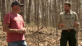Hoosier National Forest Supervisor Mike Chaveas (right) talks with a southern Indiana resident about how the work on the project will happen over 10 years or more.