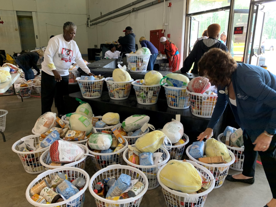 Volunteers helped give out baskets, each including a turkey. The baskets came in small, medium, and large. (Annaliese Linder/WUFT News)