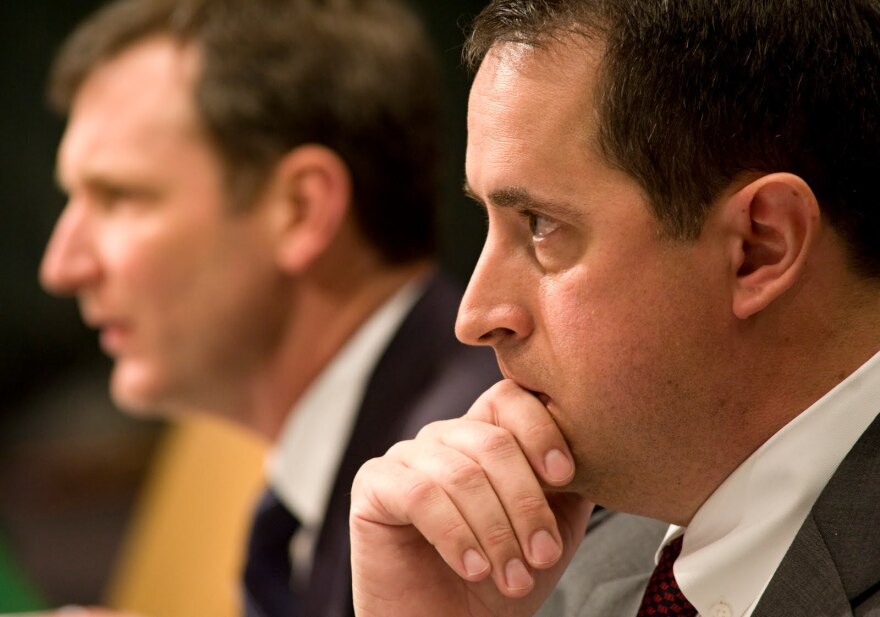 Former Washington Mutual Bank officials, David Beck, left, and David Schneider, shown testifying before the Senate subcommittee on Investigations on April 13, 2010. Schneider is named in a lawsuit that could end if a settlement is approved.