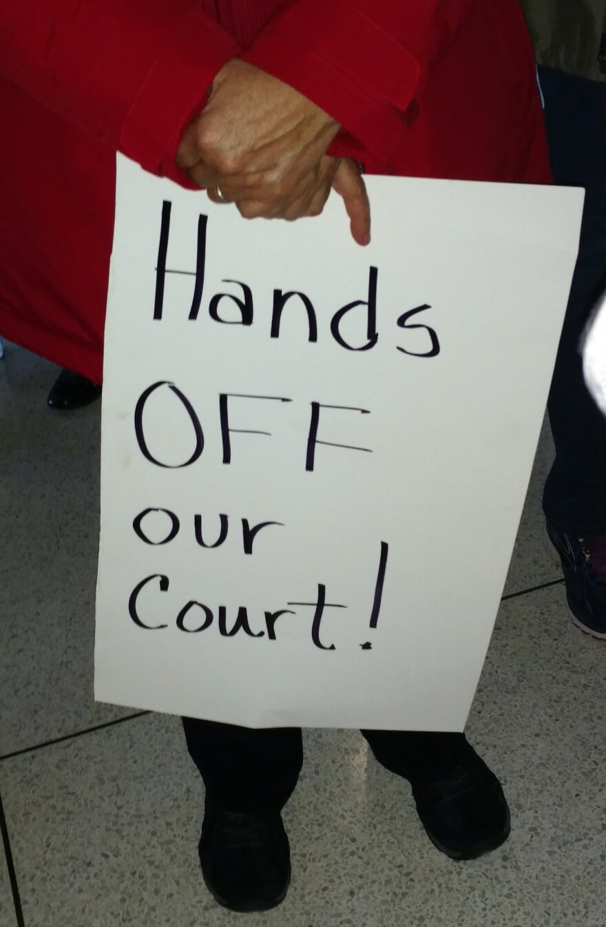 a protester holding a sign