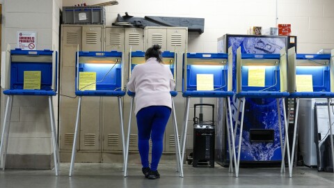 A voter casts her ballot during the Spring election Tuesday, April 2, 2024, in Milwaukee, Wis.