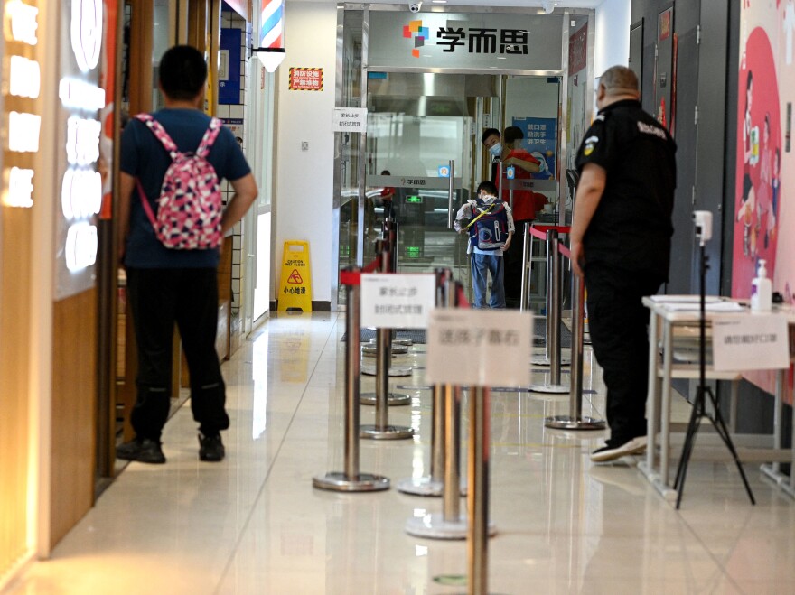 A student enters a private after-school session in Beijing's Haidian district.