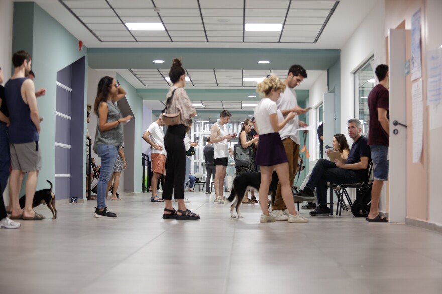 People cast their votes for the 2022 Israeli legislative election at a polling station in Tel Aviv on Tuesday.