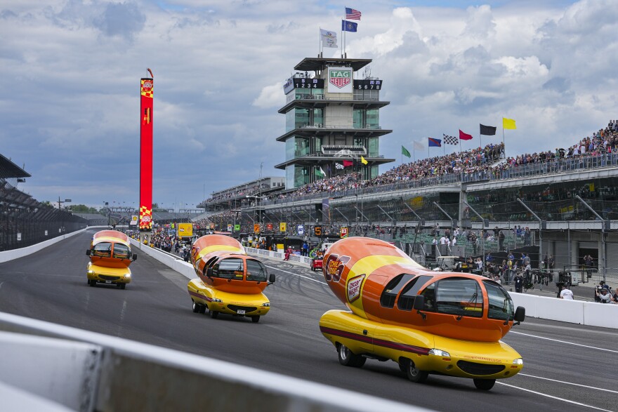 The Oscar Mayer Wienermobiles head into the first turn as they compete in the Wienie 500 following the practice session for the Indianapolis 500 auto race at Indianapolis Motor Speedway in Indianapolis, Friday, May 23, 2025.