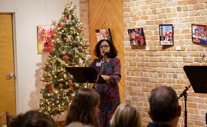 Mary Bradley making announcements before the show aired on the radio.