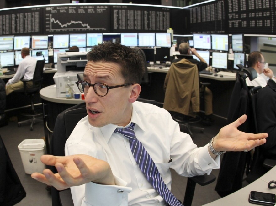 So far, European markets have not been impressed by last week's EU plan designed to fix the current crisis. Here, a trader is seen at the stock market in Frankfurt, Germany, on Monday.